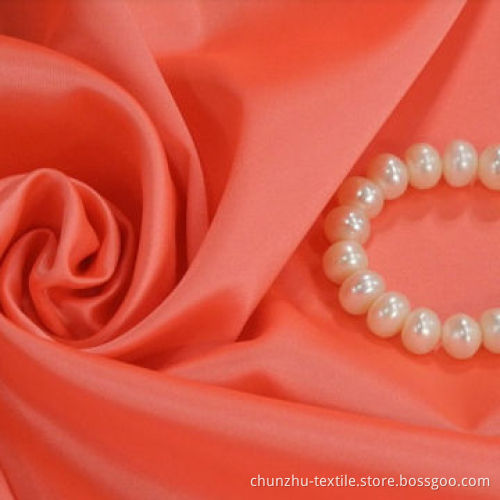 Polyester satin fabric, weighs 142gsm, 75 x 200D yarn